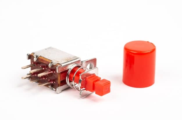 A macro photograph of a disassembled red linear switch, showcasing the internal components like the stem, spring, and metal contacts.