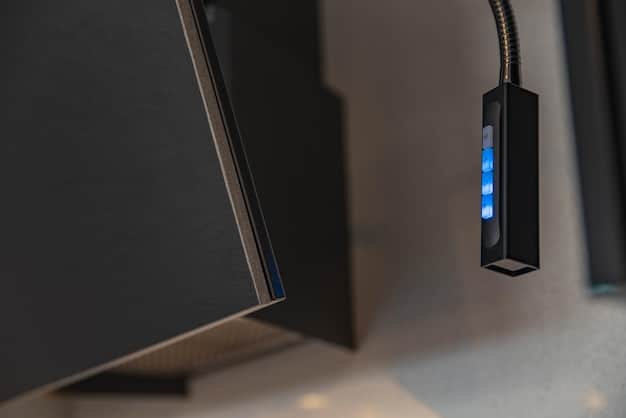 A power meter measuring the electricity consumption of a gaming PC with RGB lighting. Display the power usage with RGB on and off to highlight the difference. The meter should clearly show the wattage difference.