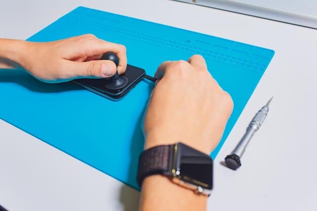 A person wearing an anti-static wrist strap and carefully holding an M.2 NVMe SSD. The focus is on the wrist strap connection to the grounded computer case and the proper handling of the SSD by its edges.