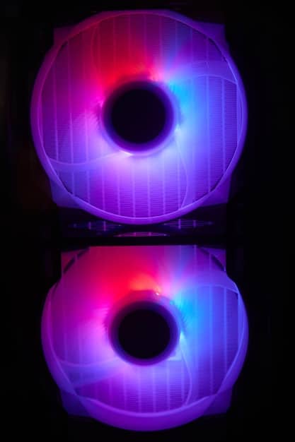A close-up of ARGB case fans with multiple LEDs displaying a rainbow wave effect. The fans are mounted inside a clean, modern gaming PC case with tempered glass.