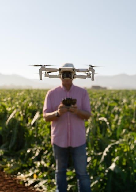 A drone (robot) flying over a vast agricultural field, scanning crops with advanced sensors, demonstrating applications beyond traditional manufacturing.