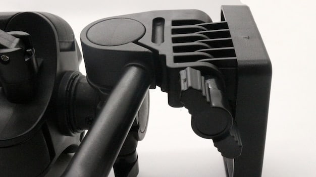 A close-up, dynamic shot of a collaborative robot arm with rounded, smooth edges, gently placing a package on a conveyor belt, with a human hand in the background maintaining a safe, respectful distance, highlighting safe human-robot collaboration.